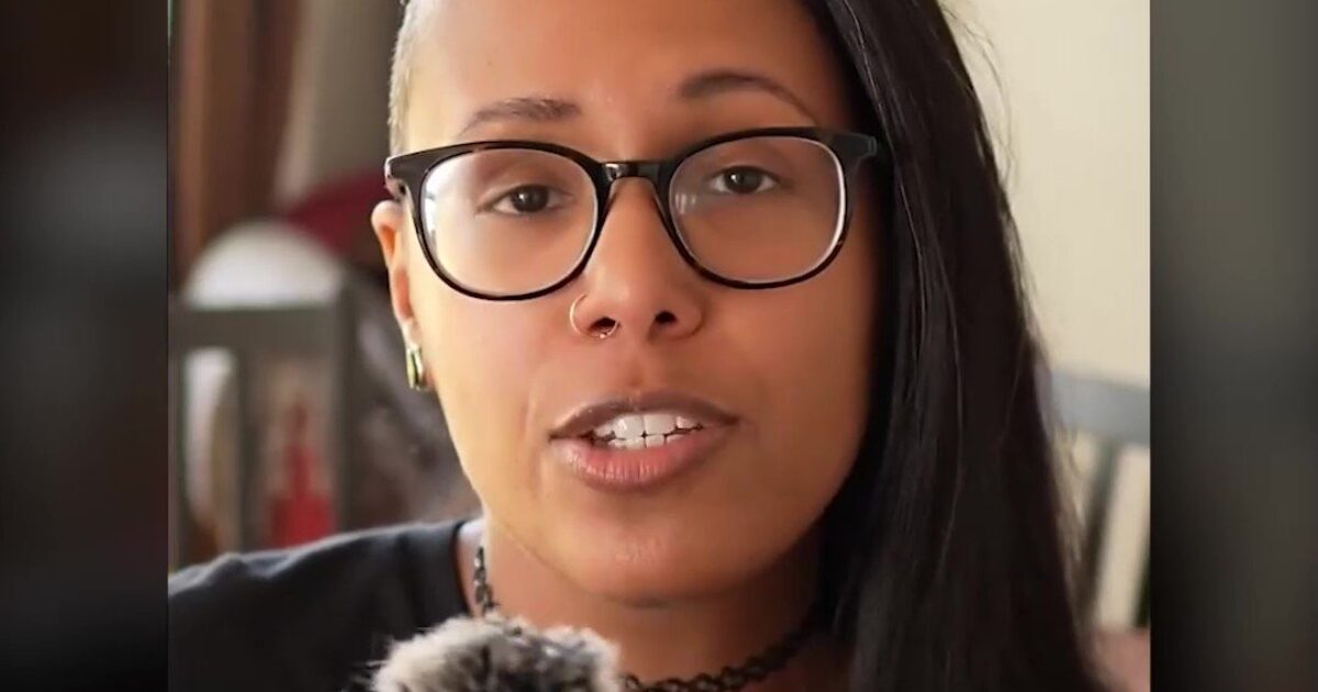 Person speaking in front of a camera, discussing themes of faith and spirituality, featuring a close-up view with a casual setting.