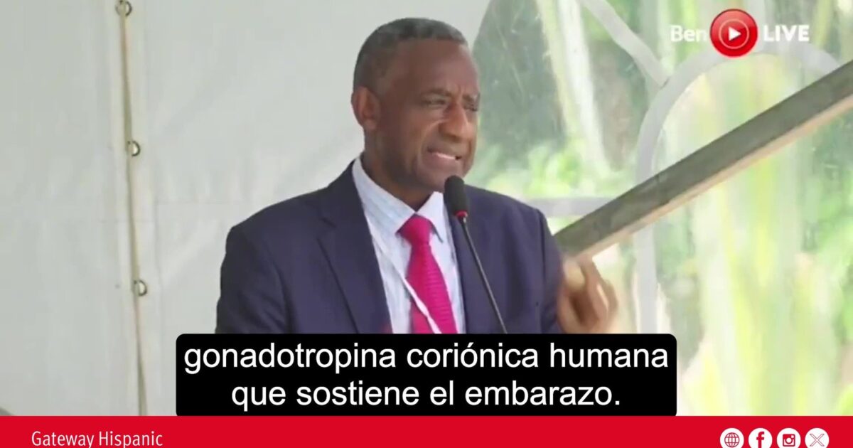 A speaker discusses human chorionic gonadotropin and its role in supporting pregnancy during a public event.