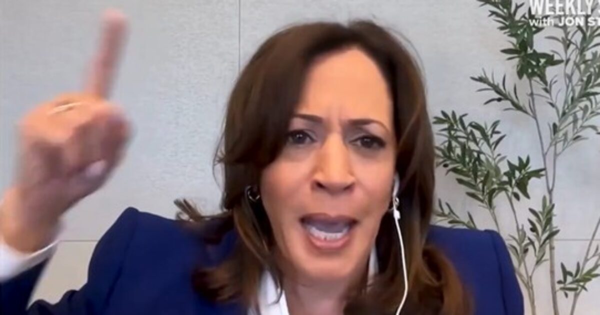 Kamala Harris passionately gestures while speaking during an online interview, emphasizing her points with a determined expression.