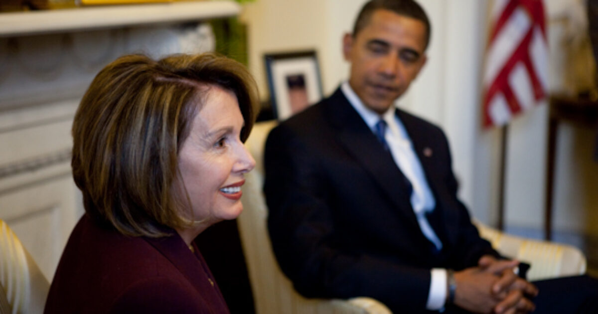 Nancy Pelosi and Barack Obama engaged in conversation in a formal setting, highlighting their roles in American politics.