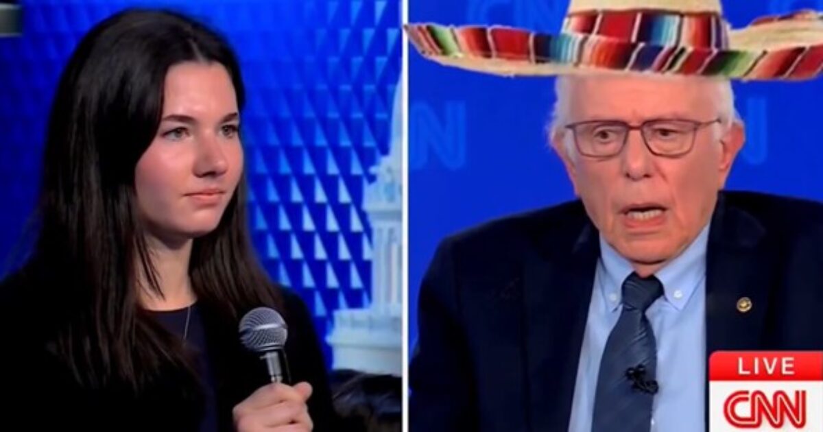 A young woman asks a question while Senator Bernie Sanders responds during a CNN town hall event, with Sanders humorously wearing a sombrero.