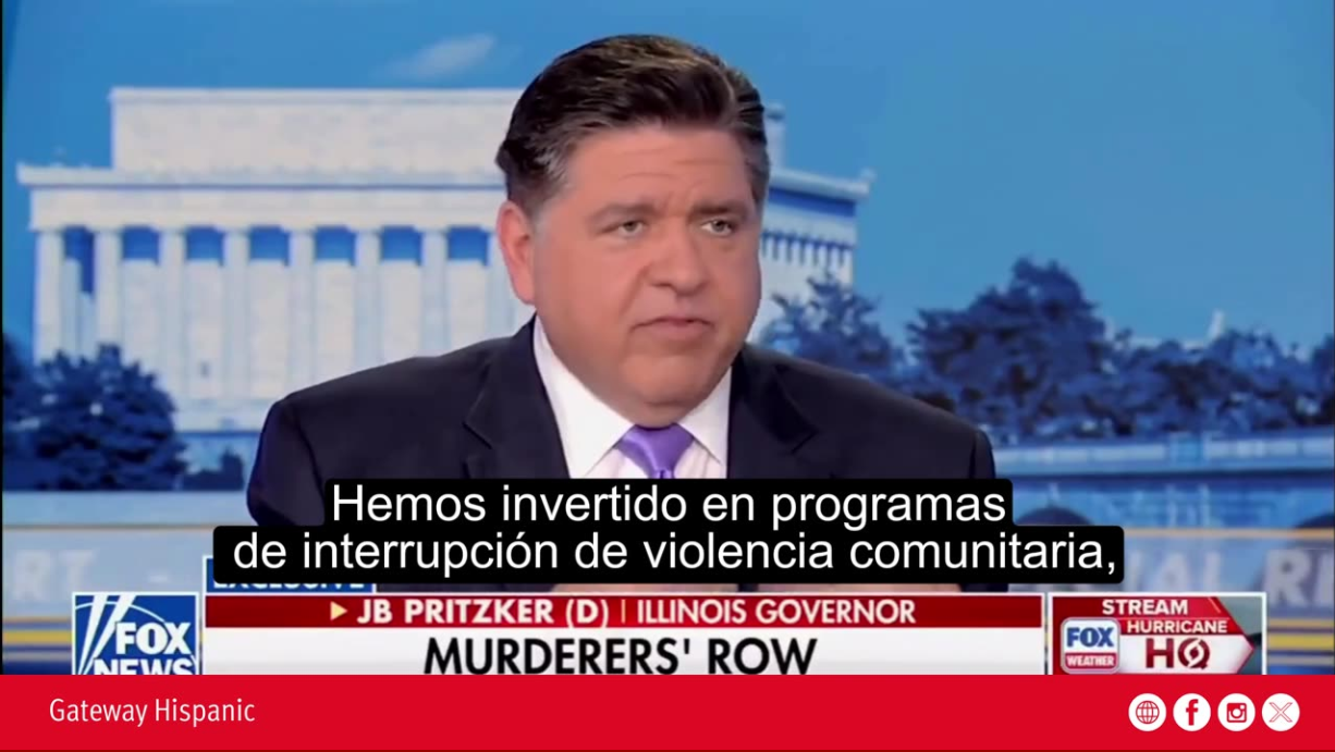 Illinois Governor JB Pritzker discusses community violence interruption programs during a Fox News interview with a backdrop of the Lincoln Memorial.