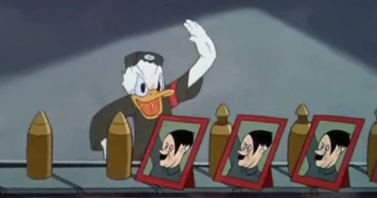 Donald Duck in military attire humorously waves beside framed caricatures of a dictator, satirizing propaganda in a classic animated scene.