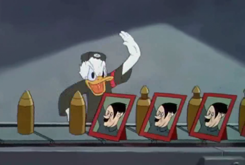Donald Duck in military attire humorously waves beside framed caricatures of a dictator, satirizing propaganda in a classic animated scene.