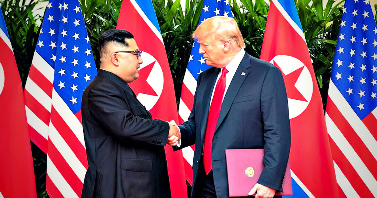 Kim Jong-un and Donald Trump shake hands during a historic summit, surrounded by flags of the United States and North Korea.