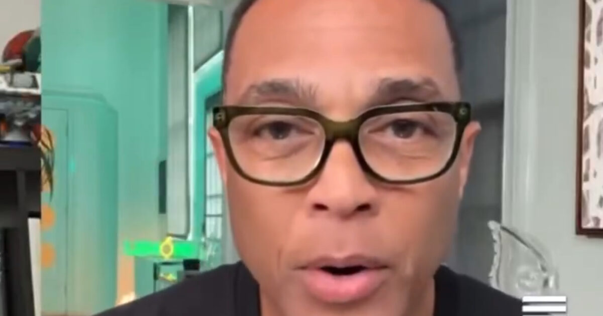 Close-up of a man with glasses speaking directly to the camera in a well-lit room with modern decor.