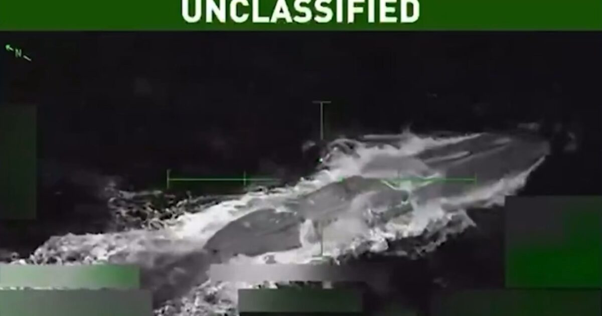 Thermal imaging footage captures an unidentified object in the ocean, labeled as unclassified, showcasing movement and water disturbance.
