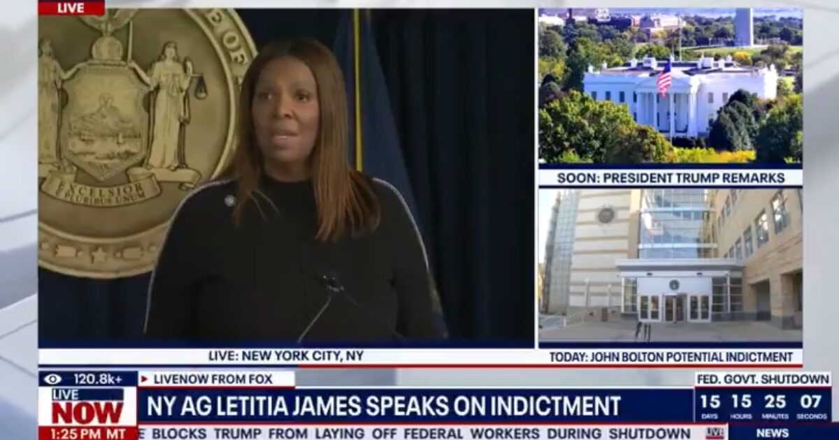 New York Attorney General Letitia James speaks at a press conference about an indictment, with the New York state seal in the background.