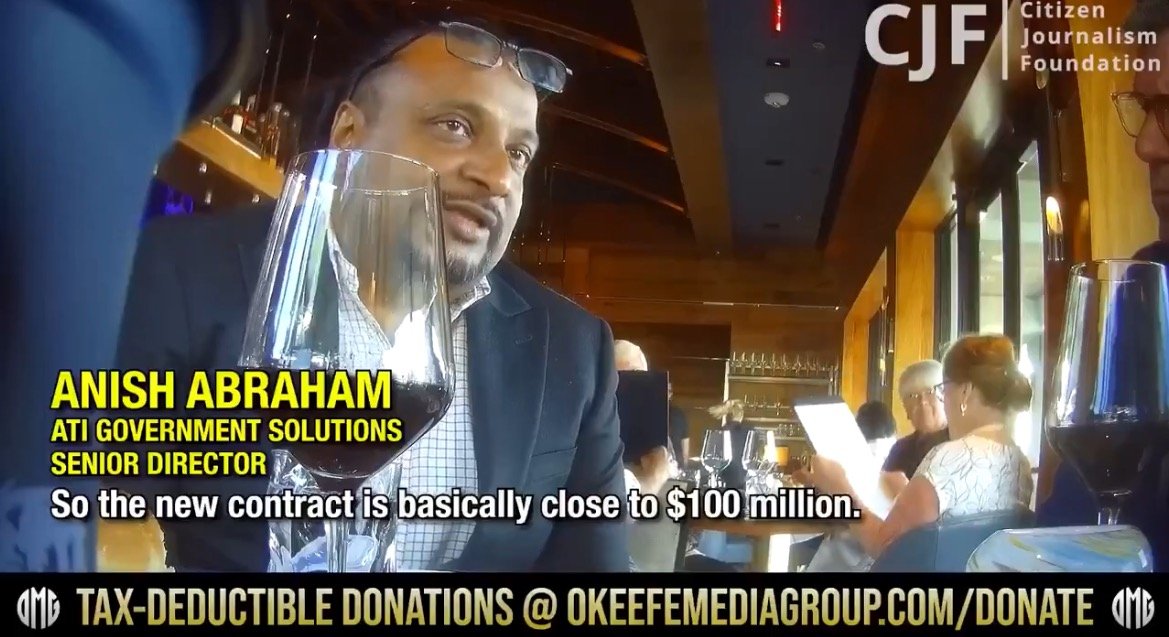 Anish Abraham, Senior Director at ATI Government Solutions, discusses a new contract valued at nearly $100 million during a meeting in a restaurant.