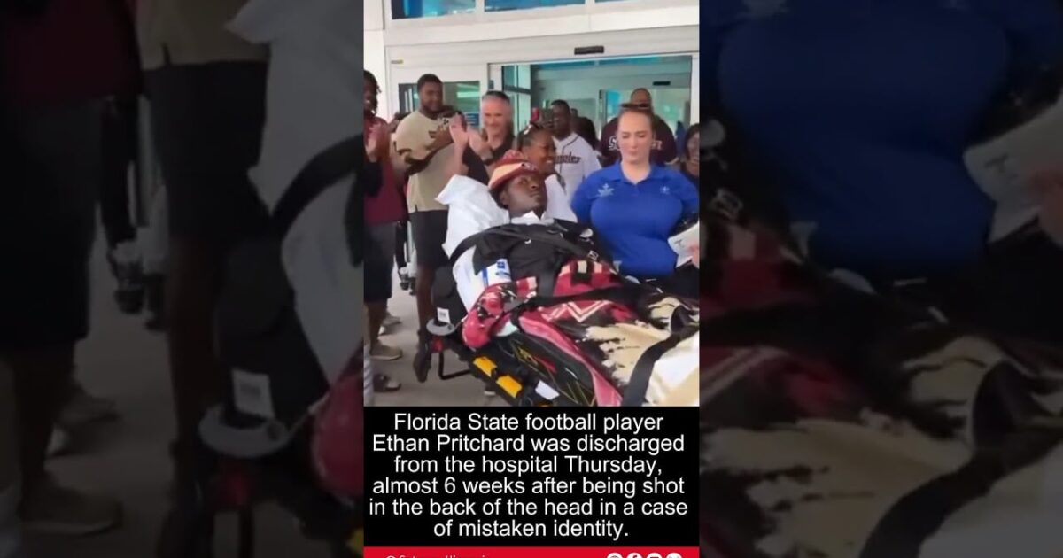 Florida State football player Ethan Pritchard being discharged from the hospital, surrounded by supporters and medical staff after recovering from a serious injury.
