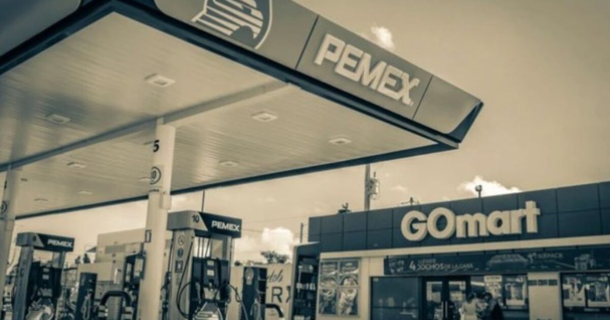 PEMEX gas station with fueling pumps and a GOmart convenience store in a monochrome setting.