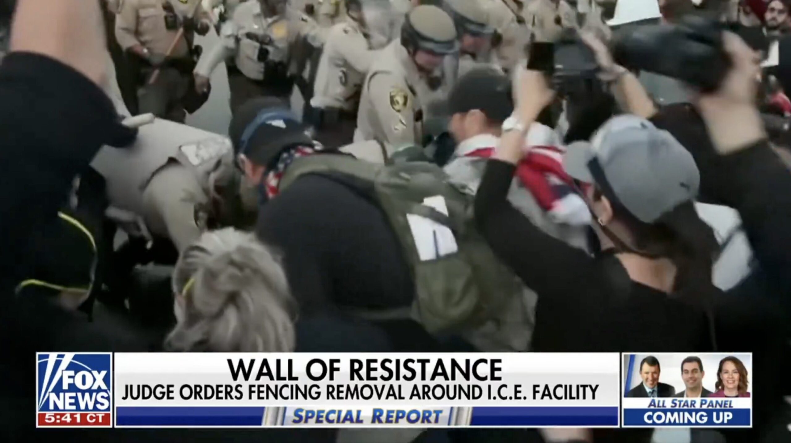 Protesters clashing with law enforcement during a demonstration against ICE facility fencing removal, capturing the intensity of civil unrest and activism.