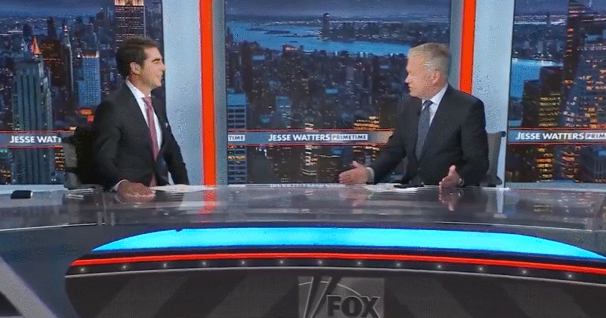 Jesse Watters and a guest discuss current events on the set of Fox News Primetime with a city skyline backdrop.