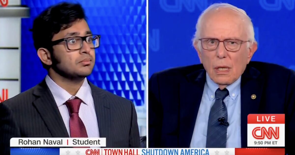 Rohan Naval, a student, engages in a discussion with Senator Bernie Sanders during a CNN town hall event.