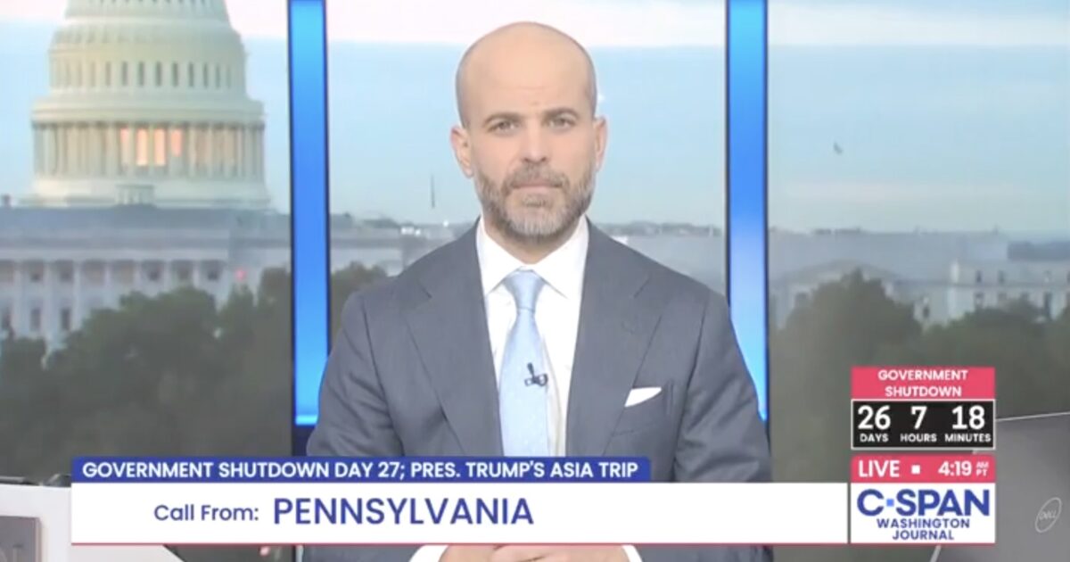 C-SPAN host discusses government shutdown on live broadcast with the U.S. Capitol in the background, highlighting ongoing political issues.