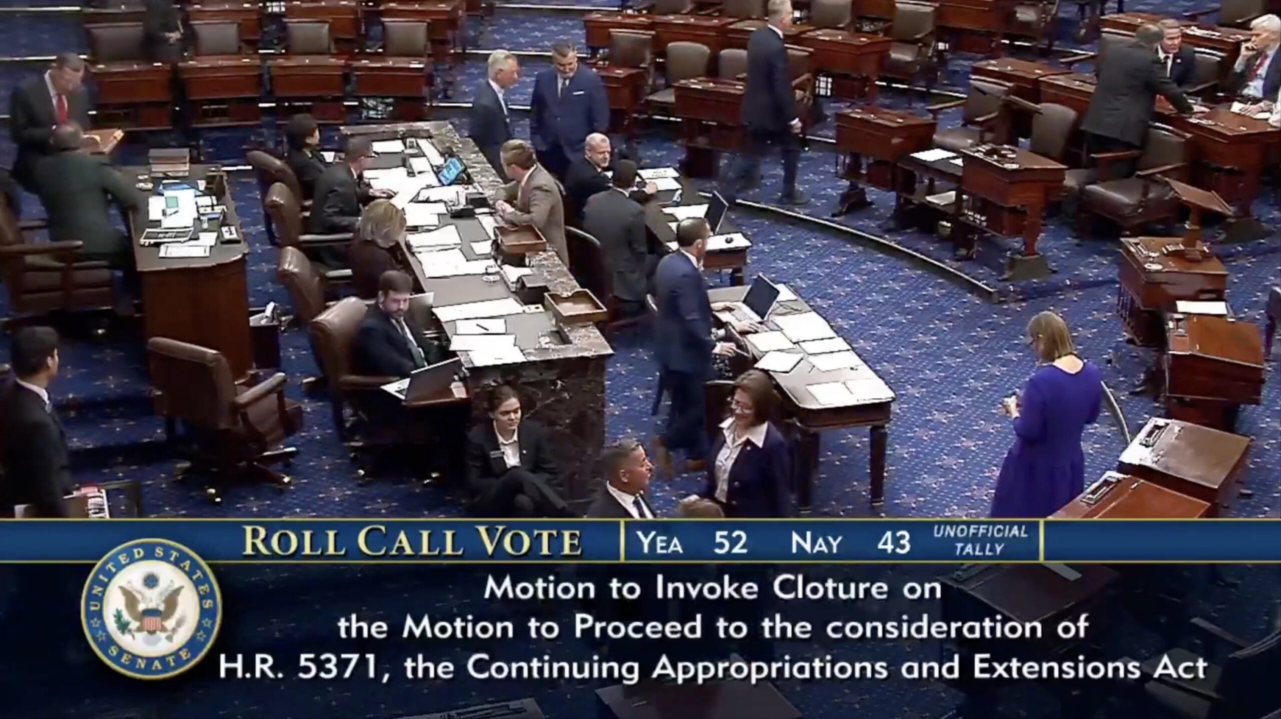 U.S. Senate members participate in a roll call vote on the motion to invoke cloture for H.R. 5371, focusing on continuing appropriations and extensions.