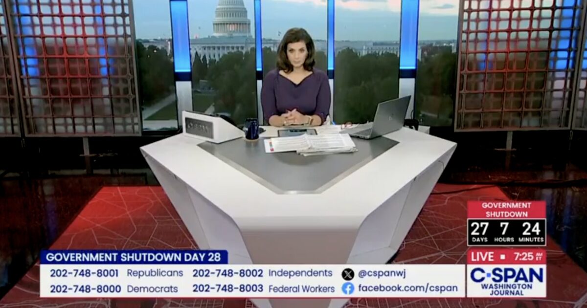 C-SPAN host discusses Government Shutdown Day 28 with the U.S. Capitol in the background, featuring a live countdown and viewer call-in information.