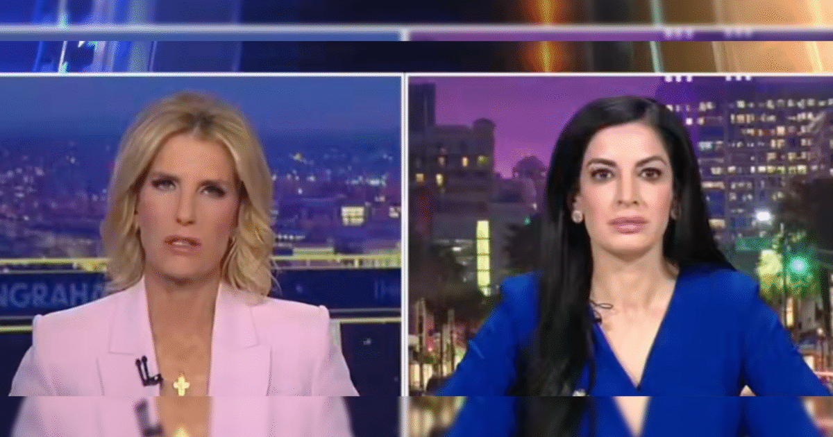 Two female news hosts engaged in discussion on a television broadcast, with a city skyline visible in the background at dusk.
