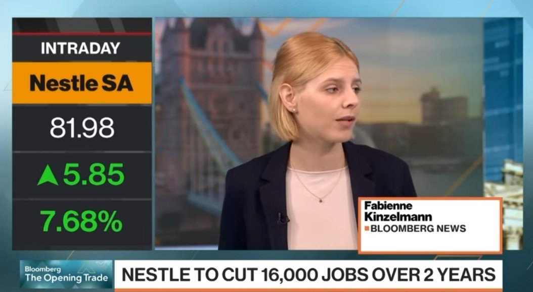 Bloomberg News segment featuring Fabienne Kinzelmann discussing Nestlé SA's announcement to cut 16,000 jobs over two years, with stock price updates displayed.