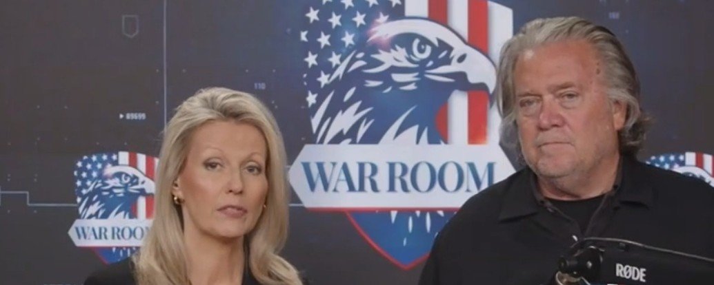 Steve Bannon and a female co-host present a discussion in front of a "War Room" backdrop featuring an eagle and American flag elements.
