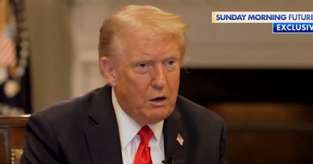 Donald Trump speaking during an exclusive interview on Sunday Morning Futures, with the Presidential seal and U.S. flag visible in the background.