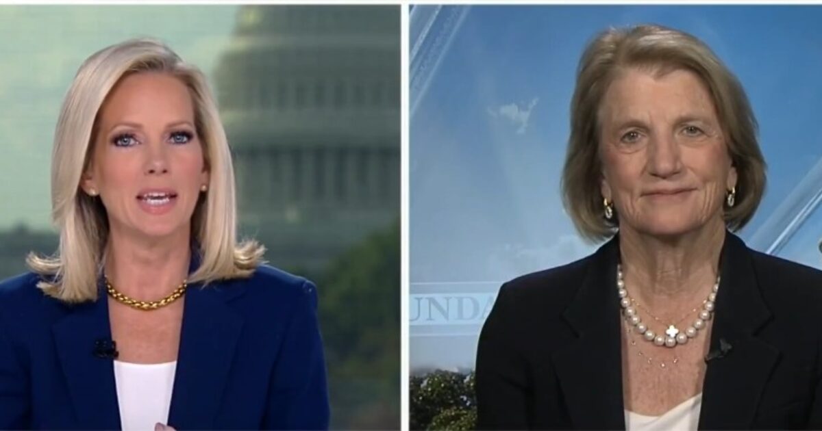 News anchors discussing current events with the U.S. Capitol in the background, featuring two women in professional attire.