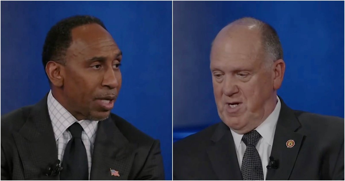 Two men engaged in a discussion during a televised interview, with a blue background enhancing the focus on their expressions and dialogue.