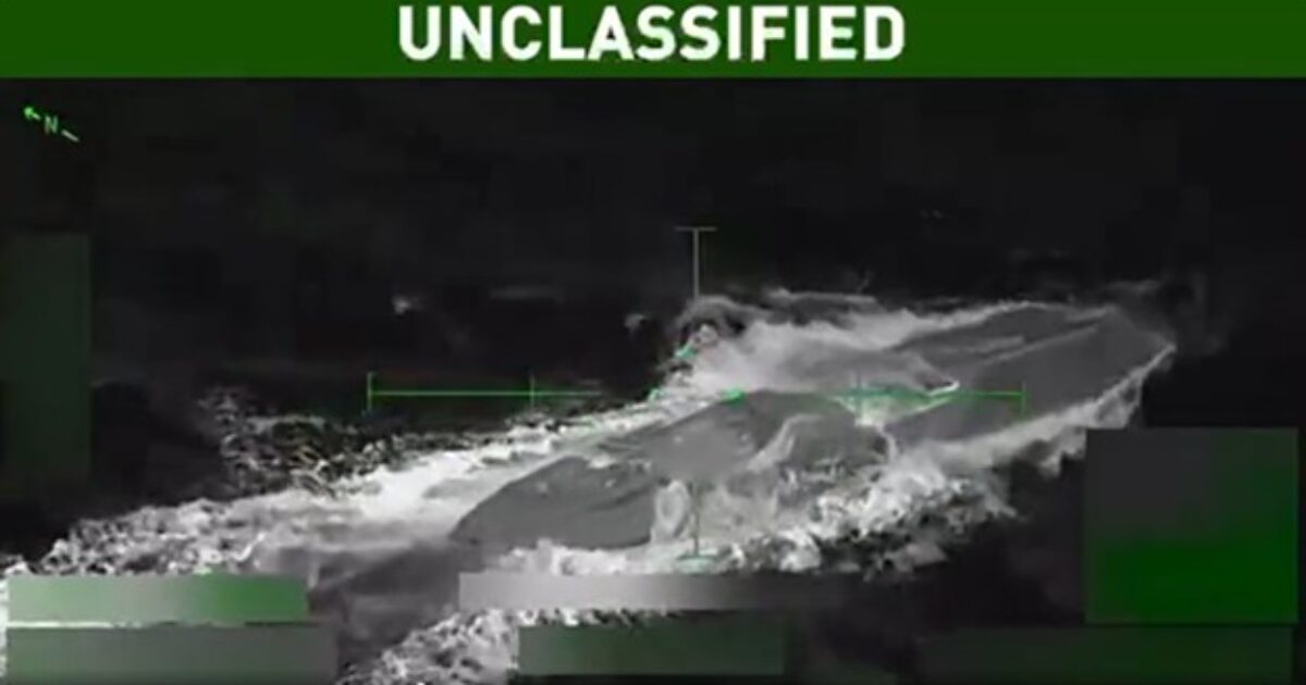 An aerial thermal imaging view of a vessel navigating through turbulent waters, labeled as unclassified.