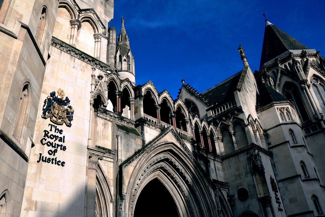 The Royal Courts of Justice, an iconic Gothic-style building in London, showcases intricate architecture and serves as a key venue for legal proceedings.