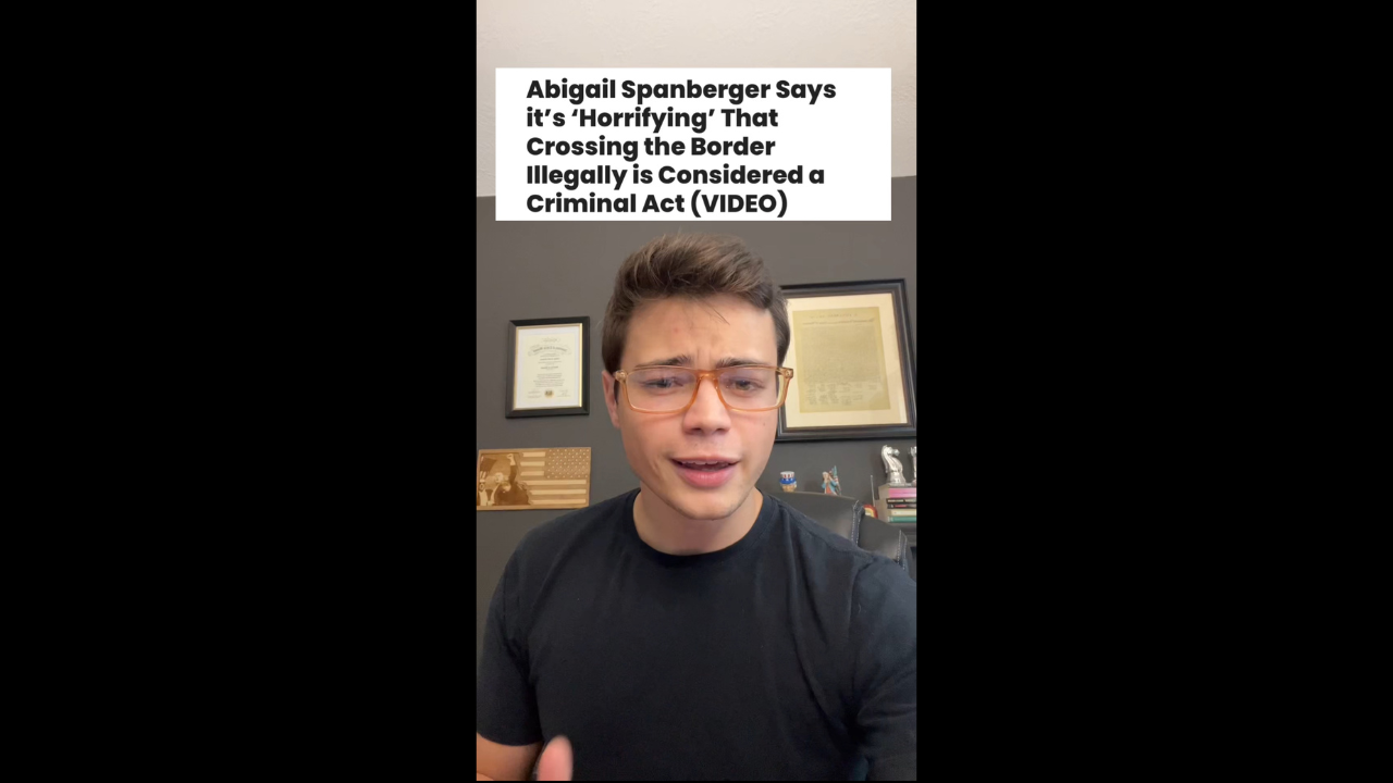Young man discussing Abigail Spanberger's views on the implications of illegal border crossing in a home office setting, with framed documents and books in the background.