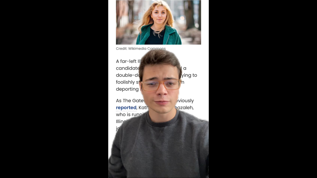 Young man with glasses wearing a gray sweater, posing in front of a blurred background, likely discussing political topics related to Illinois.
