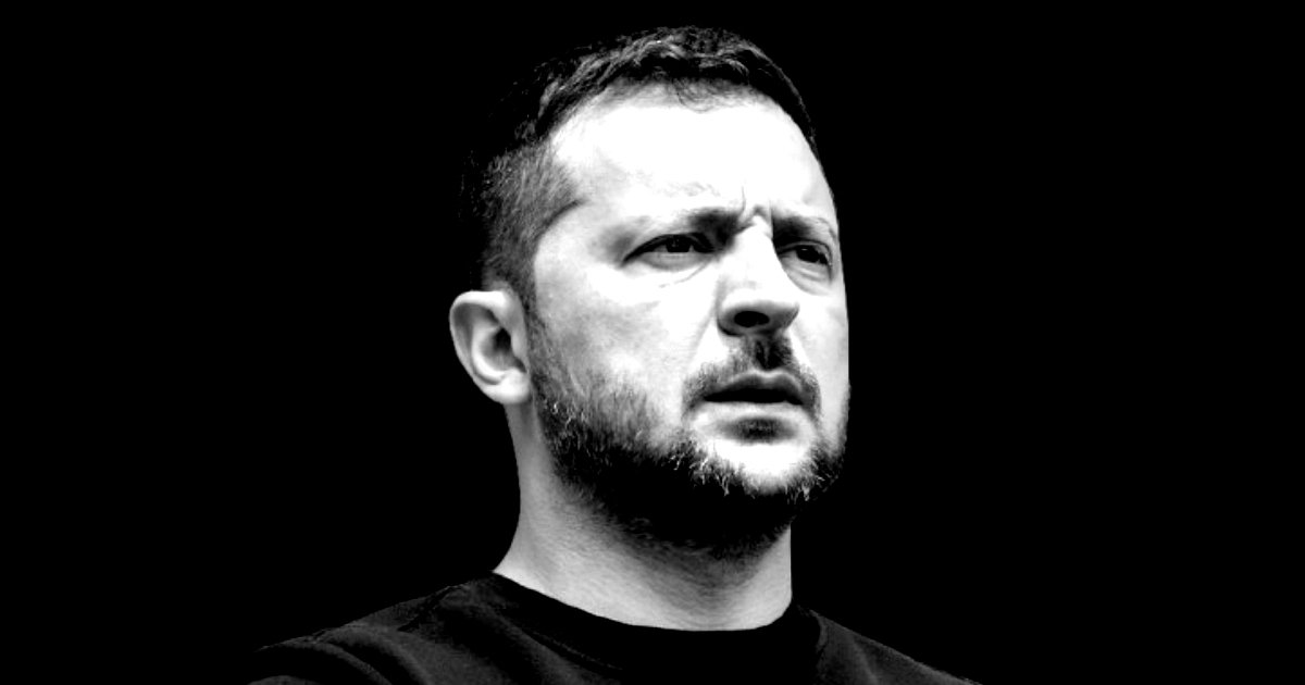 Black and white portrait of a man with a serious expression, showcasing strong facial features against a dark background.