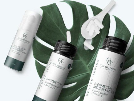 Wellness products including ivermectin-mebendazole capsules and skincare cream on a tropical leaf background, promoting health and wellness solutions.