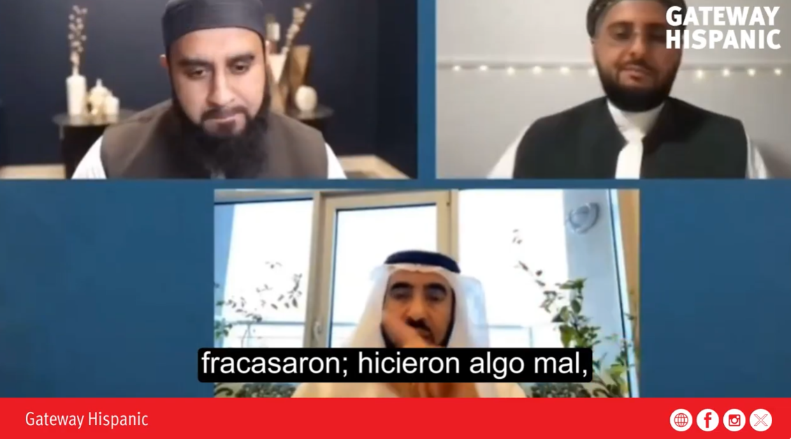 Three men engage in a discussion during a virtual meeting, with a focus on cultural and social topics, featuring a modern interior background.