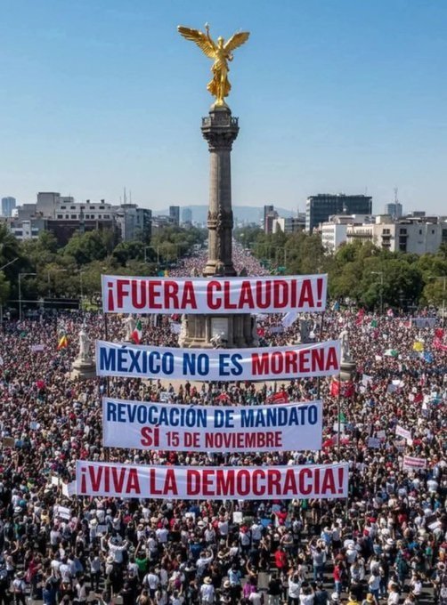 Massive protest in Mexico City against Claudia Sheinbaum with banners demanding political change and a referendum, showcasing public engagement for democracy.