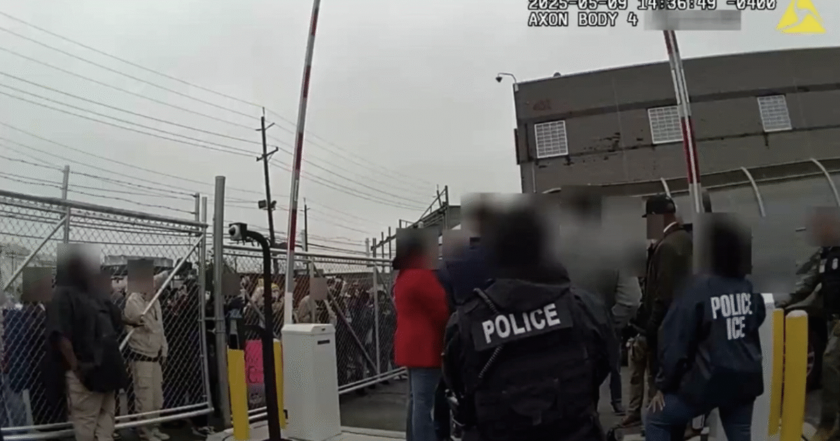Law enforcement officers monitor a crowd at a secure facility entrance, highlighting the interaction between police and attendees during a significant event.