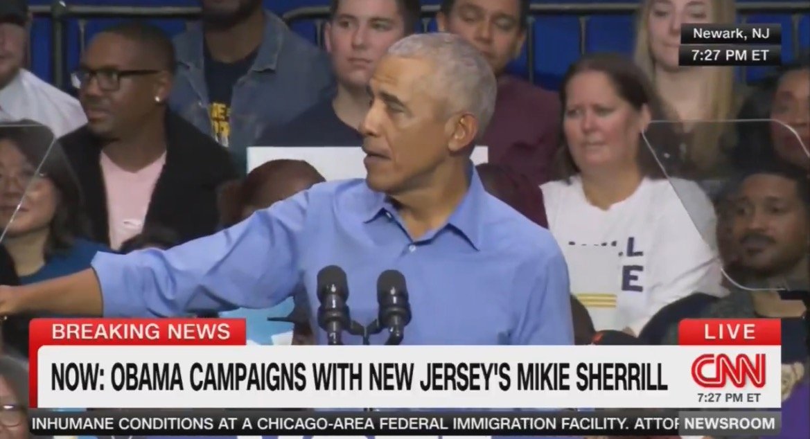 Barack Obama speaks at a campaign event in Newark, New Jersey, alongside Mike Sherrill, engaging with a diverse audience.
