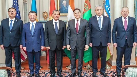 Six male leaders from various countries stand together in a formal setting, showcasing their national flags in the background, highlighting international cooperation and diplomacy.